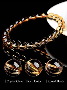 Detailed macro view of natural Brazilian citrine beaded bracelet with high clarity.