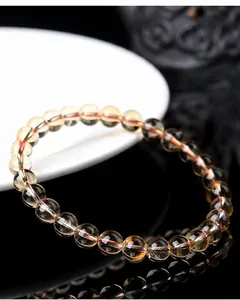 Detailed view of 6A grade electroplated yellow crystal round bead bracelet jewelry