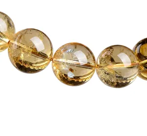 Close-up of premium 5A natural citrine round beads showing translucent crystal texture