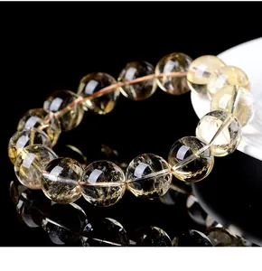 Detailed close-up of natural citrine crystal bracelet showing translucent yellow beads