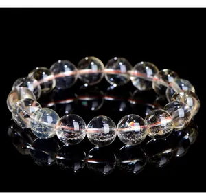 Detailed macro view of high-quality natural yellow citrine quartz crystal round bead bracelet