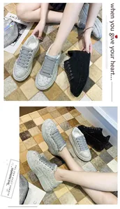 Detailed view of women's sparkly rhinestone platform sneakers with thick soles