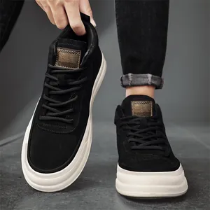Men's black suede mid-top sneakers with thick white platform soles for street fashion.