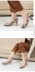 Macro detail of elegant snake-print chunky heel pumps with comfortable round toe design
