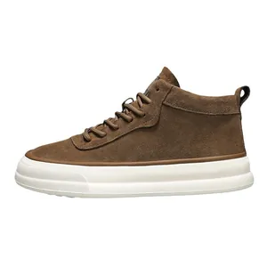 Stylish brown suede mid-top sneakers featuring thick white soles and a casual street design