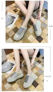Close-up of luxury women's silver sneakers with all-over rhinestone embellishments