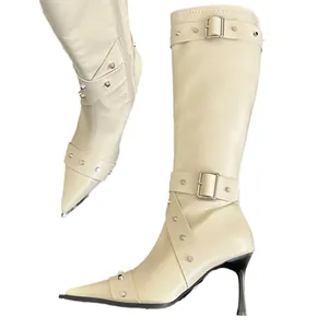 Elegant cream pointed-toe knee-high boots with silver studs and thin high heels
