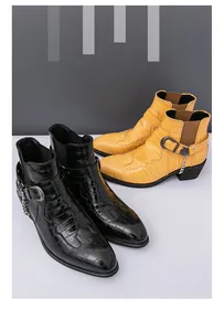 Detailed view of men's crocodile pattern Chelsea boots in black and yellow