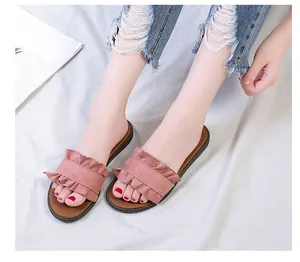 Casual pink flat slide sandals with stylish ruffle wood ear lace design for women beach wear