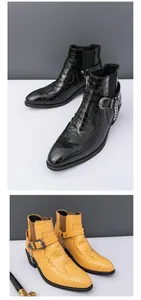 Detailed view of men's crocodile pattern Chelsea boots with metal chain buckle