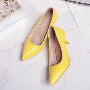 Elegant bright yellow patent leather pointed-toe pumps with a comfortable kitten heel height
