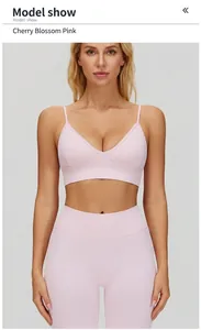 Detail of a pink V-neck sports bra with adjustable thin straps for yoga and fitness.