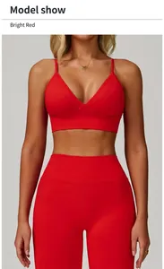 Detailed shot of a model wearing a bright red V-neck sports bra and yoga leggings