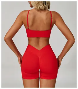 Back view detail of red sports bra and V-waist yoga shorts for fitness training.
