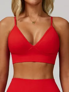 Women's red V-neck yoga sports bra with adjustable thin straps and quick-dry fabric