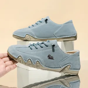 Side view of blue low-top casual shoes with a unique octopus-style non-slip rubber sole