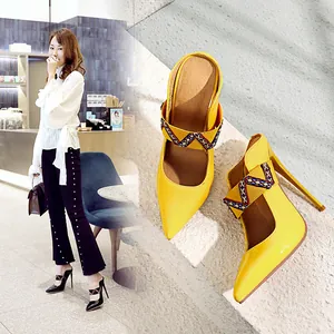 Vibrant yellow pointed toe high heel pumps with ethnic pattern cross straps
