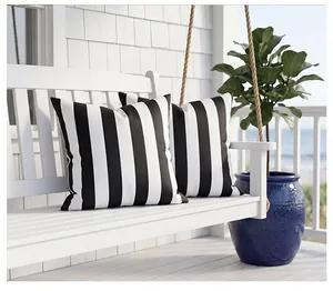 Outdoor waterproof black and white wide stripe pillowcases on a white porch swing