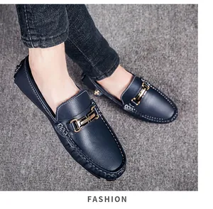 Detail view of men's navy blue loafers with gold buckle and cozy warm fleece lining.