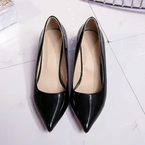 Elegant top-down view of sleek black patent leather pointed-toe high heel pumps