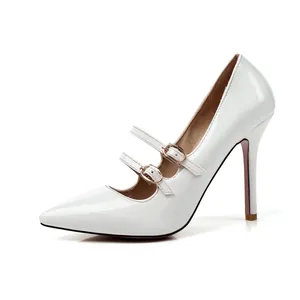 White patent leather pointed-toe pumps with double metal buckles and stiletto heels
