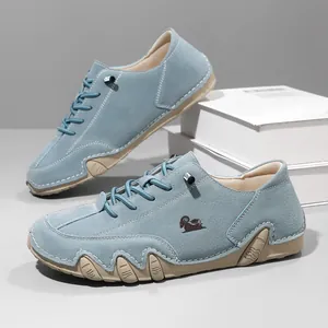 Side view of men's light blue suede casual shoes with unique octopus wrap-around sole