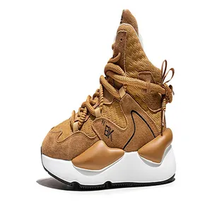 Detailed side view of camel chunky sneakers with white sole and lace-up design
