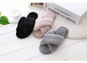 Three pairs of cozy faux fur cross-strap house slippers in black, pink, and grey