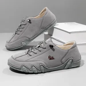 Minimalist grey suede low-top casual shoes with a unique anti-slip octopus-style sole design