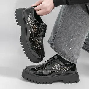 Black patent leather platform dress shoes for men with rivets and gold floral patterns
