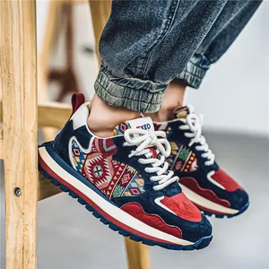 Men's ethnic style athletic sneakers with vibrant geometric patterns and navy suede accents