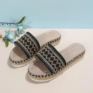 Women's ethnic style platform sandals with embroidered straps and espadrille rope soles.