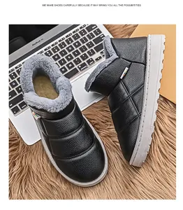 Detail of black quilted men's slip-on winter boots with plush gray faux fur lining