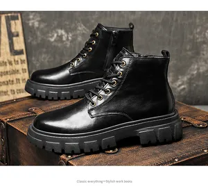 Detailed side view of classic men's black leather work boots on a vintage trunk