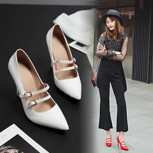 Detailed shot of white pointed-toe high heel pumps with double straps and model lifestyle