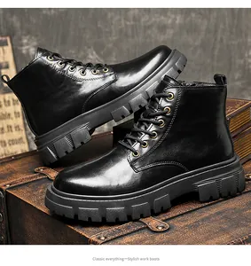Detailed macro view of stylish black leather work boots presented on a vintage suitcase