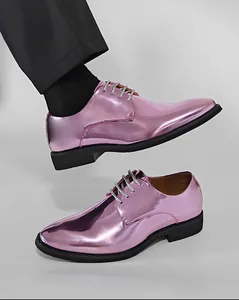 Macro detail of shiny metallic pink men's dress shoes featuring stylish silver laces.