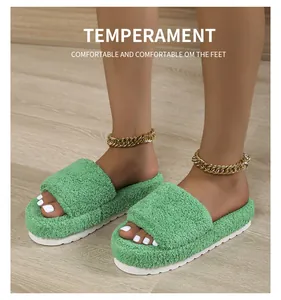 Detail view of green fuzzy platform slippers with comfortable toweling texture