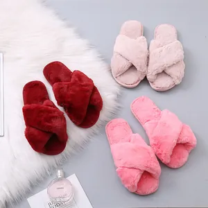 Soft fuzzy cross-strap slippers for women shown in three vibrant pink shades