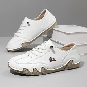 Macro view of white leather low-top casual shoes with octopus-style soles