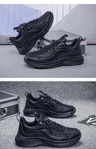 Detailed view of black water-resistant leather sneakers with thick soles for men