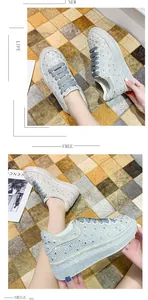Close-up detail view of women's sparkling rhinestone platform sneakers with thick soles