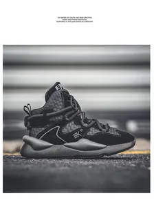 Detailed side view of black high-top chunky sneakers with woven texture and thick sole
