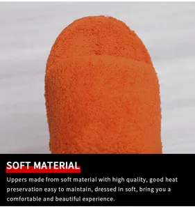 Close-up of soft orange towel-like fabric on platform fuzzy slippers for women.