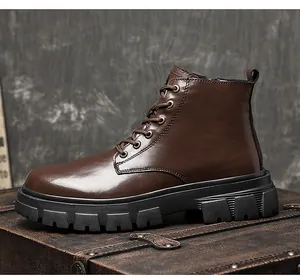 Side view of brown leather men's Martin boots with chunky black soles on vintage trunk