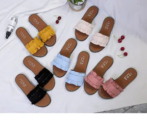 Flat wood-ear ruffle slides for women available in yellow, blue, pink, beige and black