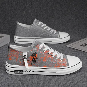 Sneakers in tela grigia traspirante per ragazzi con motivo a schizzi d'arancione