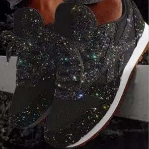 Sparkling black platform sneakers featuring vibrant multicolored rhinestones for casual wear