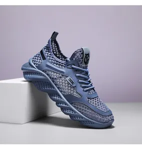 Close-up of breathable blue mesh material and thick wavy soles on men's lightweight sneakers