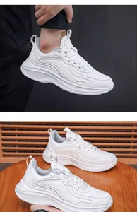 Close-up of white water-resistant leather sneakers for men with thick cushioning soles
